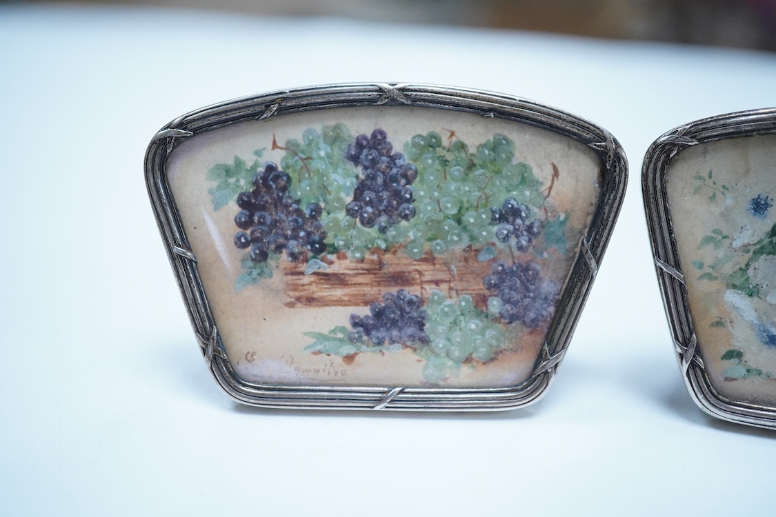 A set of four white metal and inset floral painted panel menu holders, signed Le Maitre, width 58mm, metal unmarked.